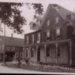 The Dublin Milling Company building to the left of the J.B. Rosenberger home, which was destroyed by fire in May 1985.