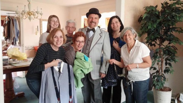 The dapper-looking Steve Runk, who portrays Charlie Cowell in NVMT's upcoming production of "The Music Man", is surrounded by members of the costume committee after putting the finishing touches on his outfit. — with Hannah Yeretzian, Joanne Holnick Urquhart, Steve Runk and Rita Lidsky. Credit: https://www.facebook.com/Neshaminy-Valley-Music-Theatre-130500913980/?fref=nf