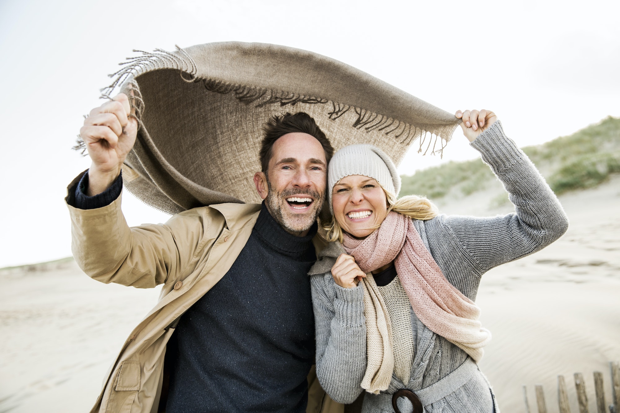 Portrait of happy couple on beach