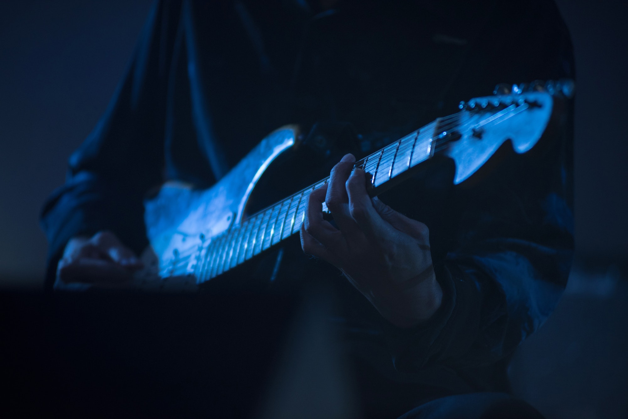 Guitarist playing live music on the stage