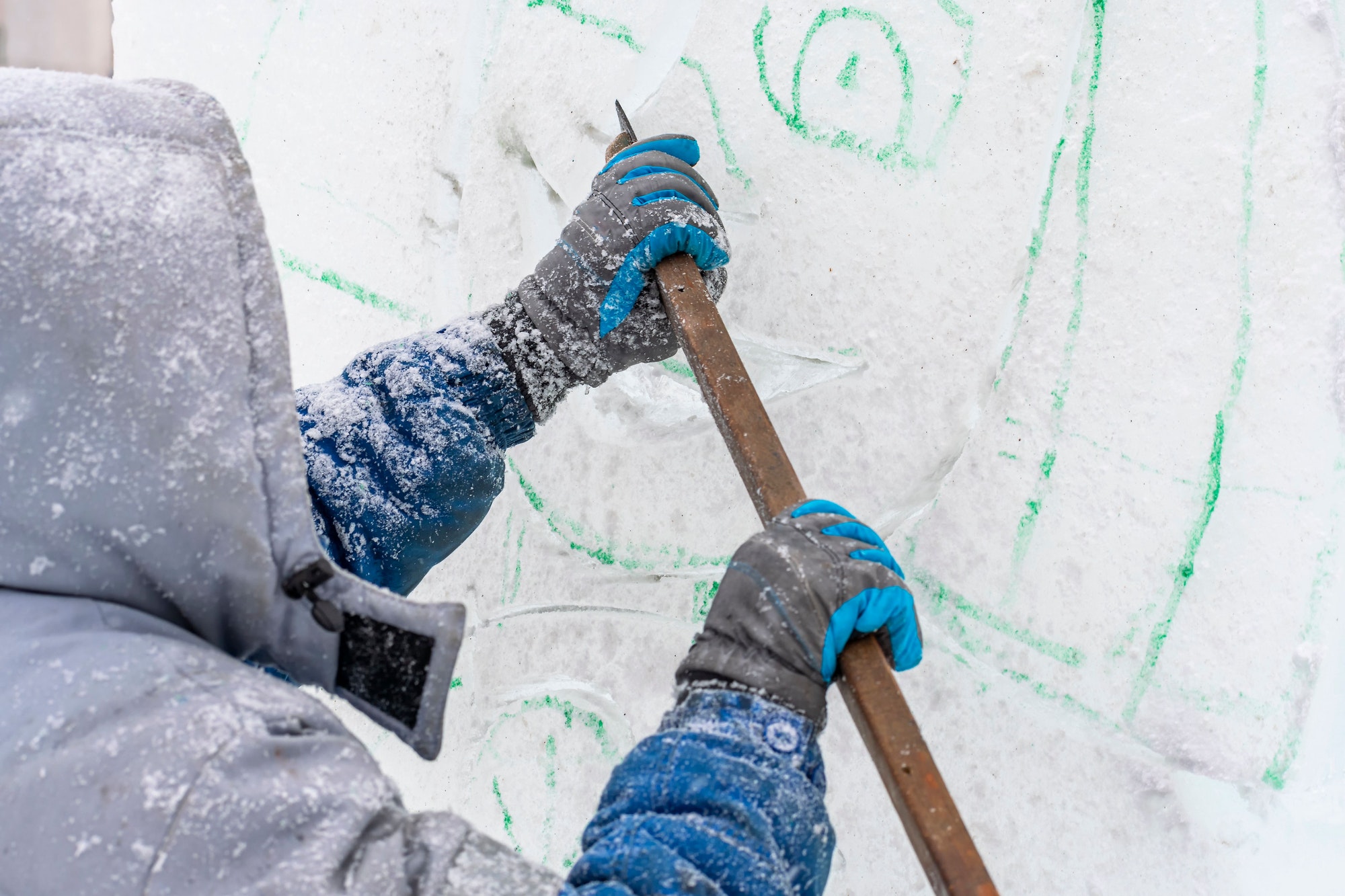 Making Christmas decorations. master sculptor carves ice sculpture with metal cutter. Handmade work Making Christmas decorations. master sculptor carves ice sculpture with metal cutter. Handmade work