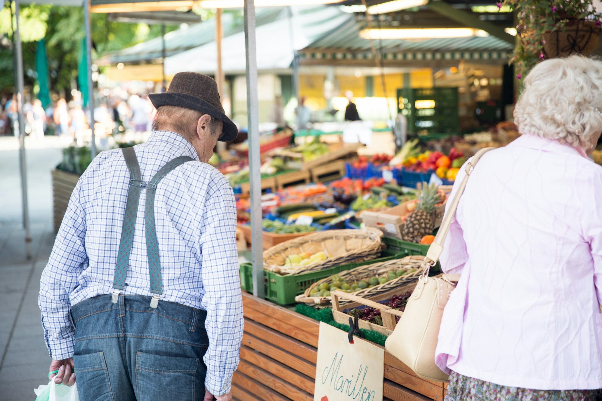 Elderly shoppers at a farmers market in Munich, Germany