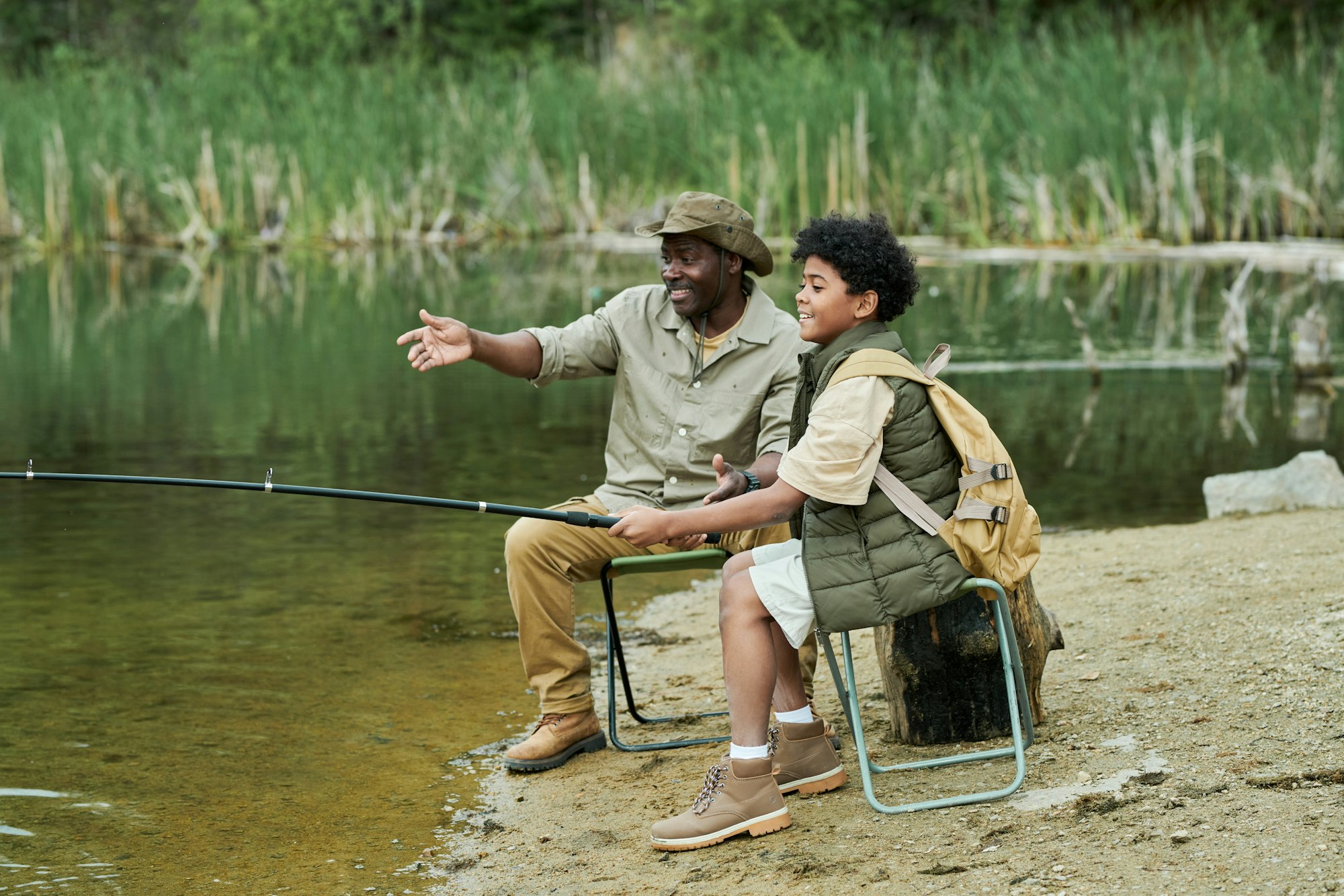 Son fishing together with his dad