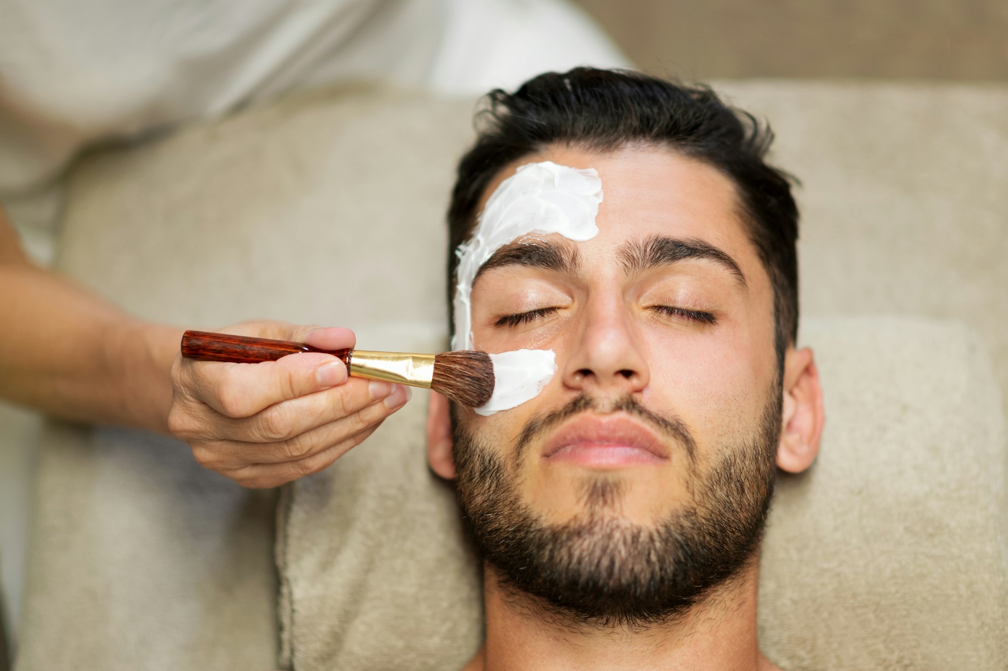 Man having skin care treatment in spa