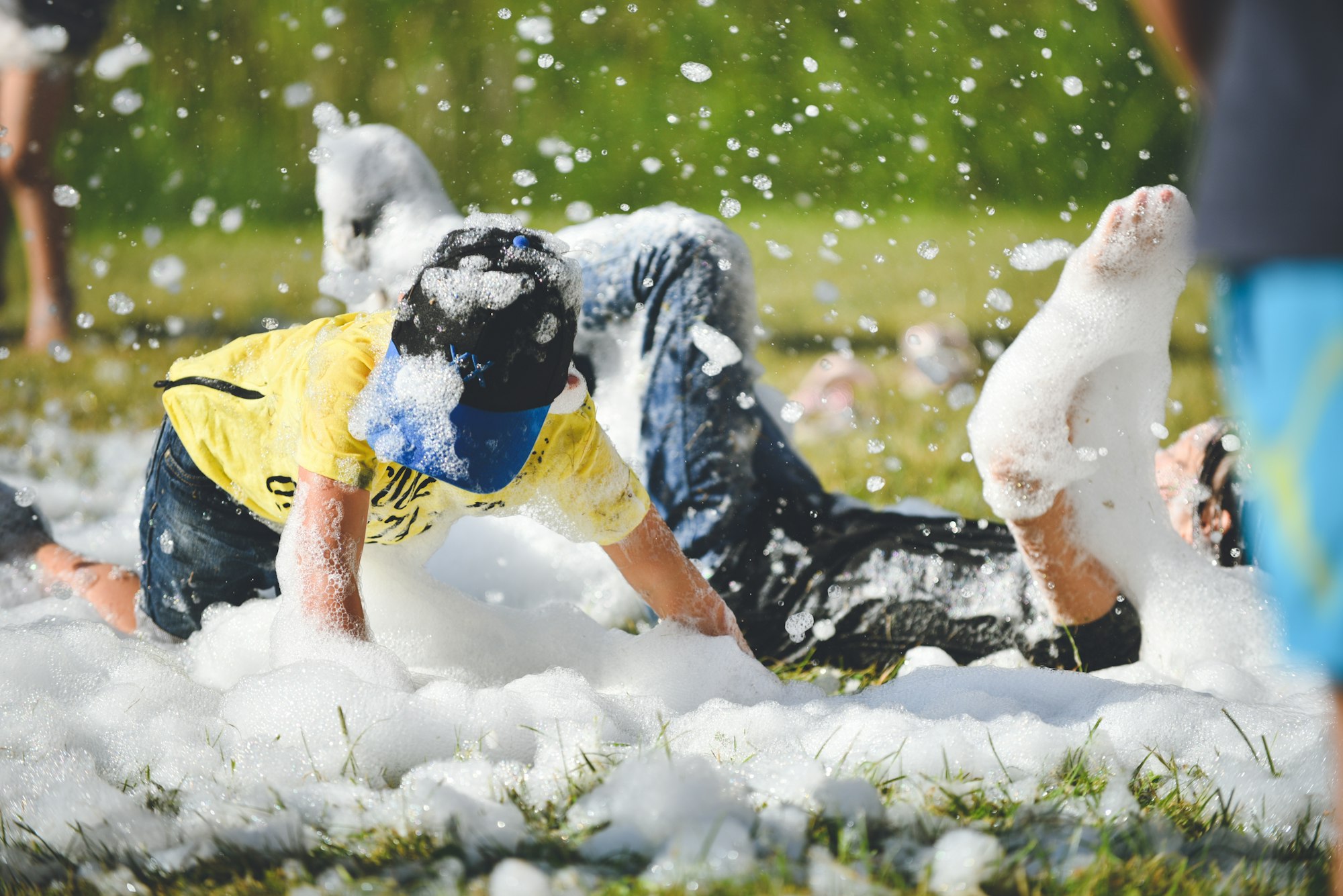 Young people in the foam. A foam party. Young people in the foam. A foam party.