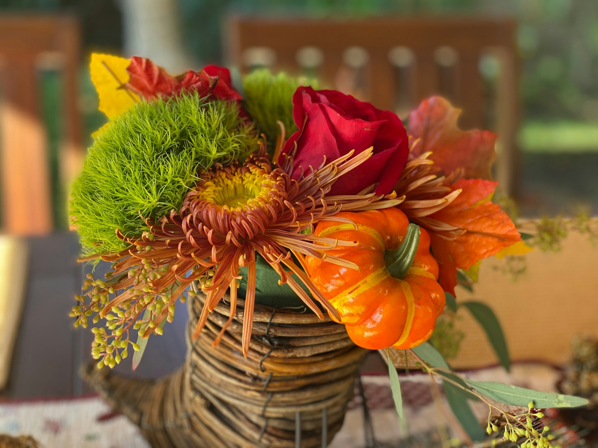 cornucopia centerpiece arrangement on the thanksgiving table this fall holiday season