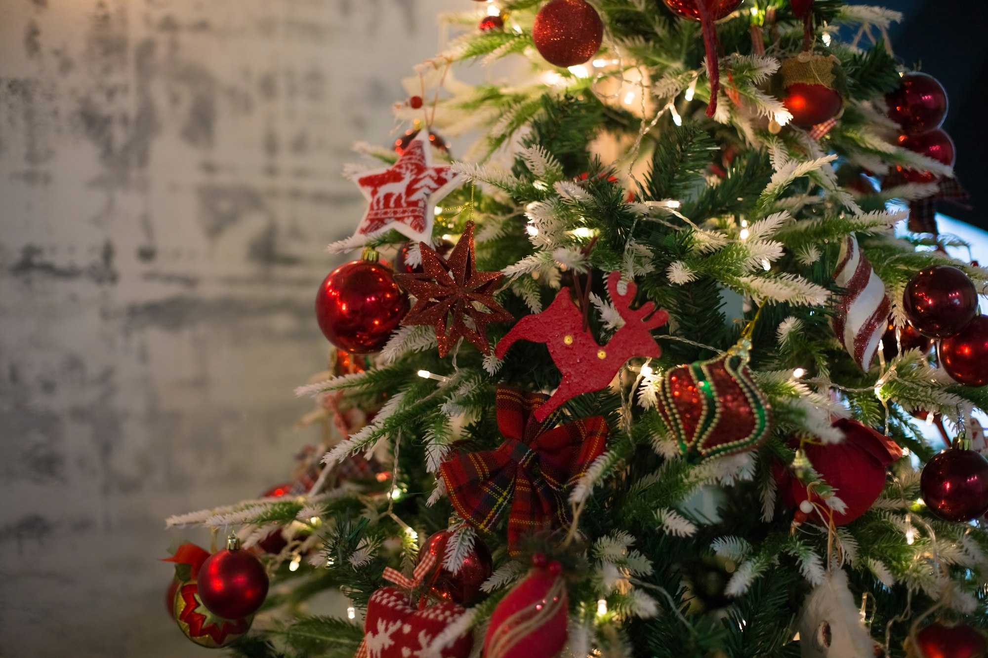 Close-Up Of Christmas Tree. Christmas Tree with Balls. Red Christmas tree.