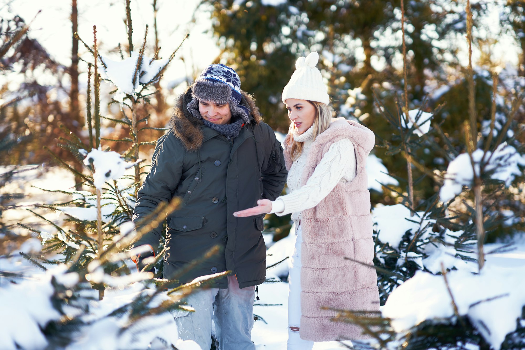 Couple on christmas tree market during winter