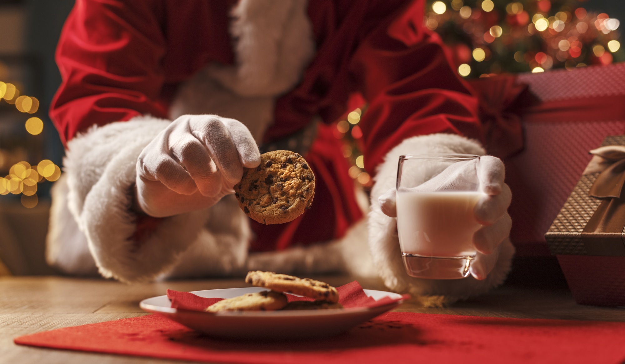 Santa Claus having a delicious snack