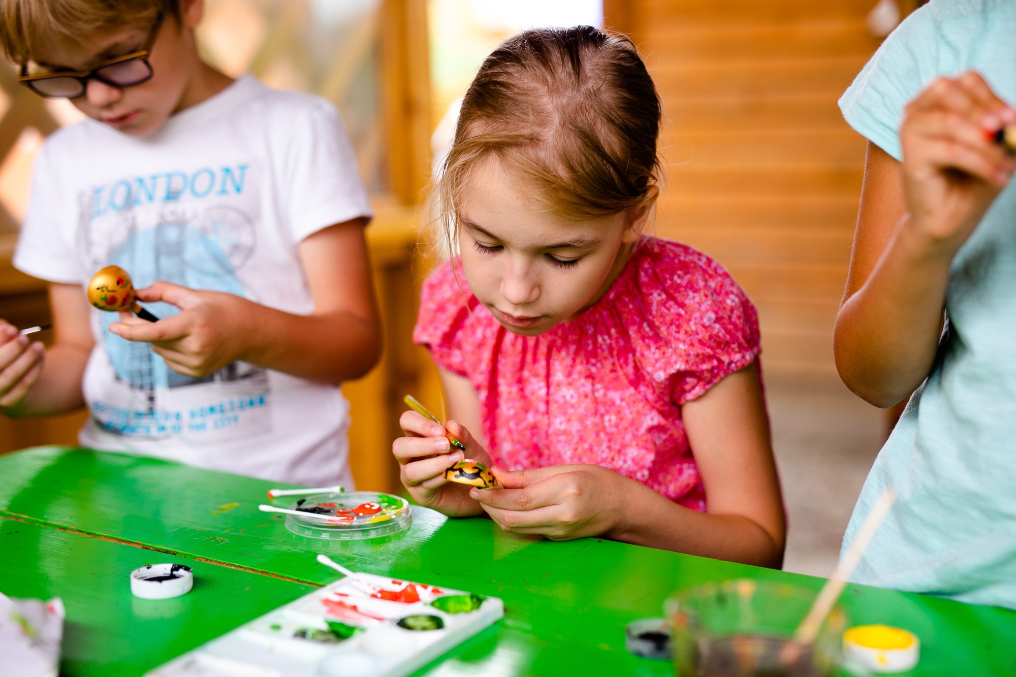 Kids crafting and painting in children’s camping