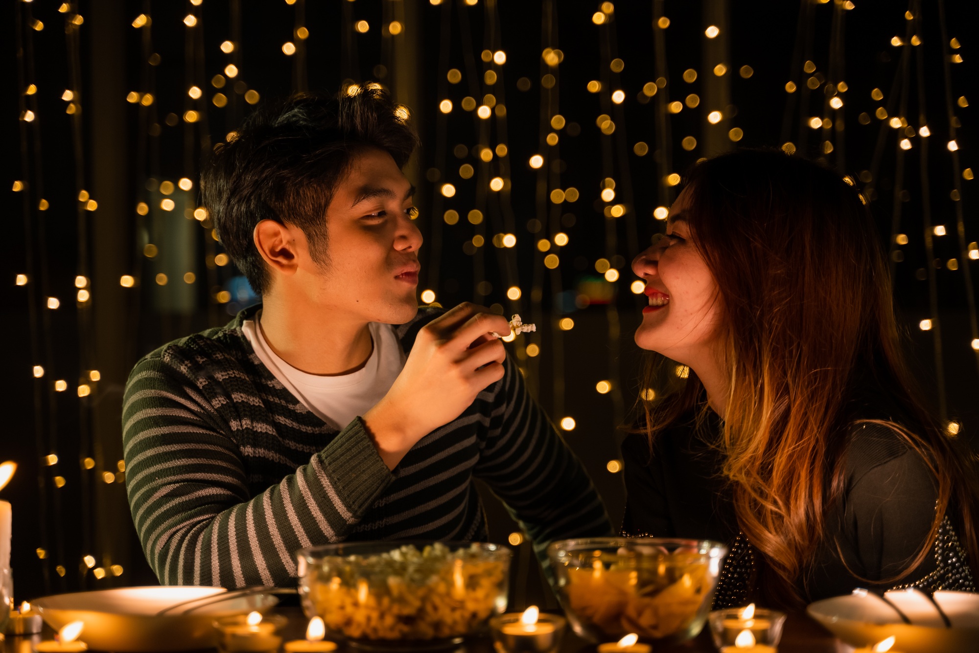 young couple celebrate at night party, romance date and love concept for Valentine's Day