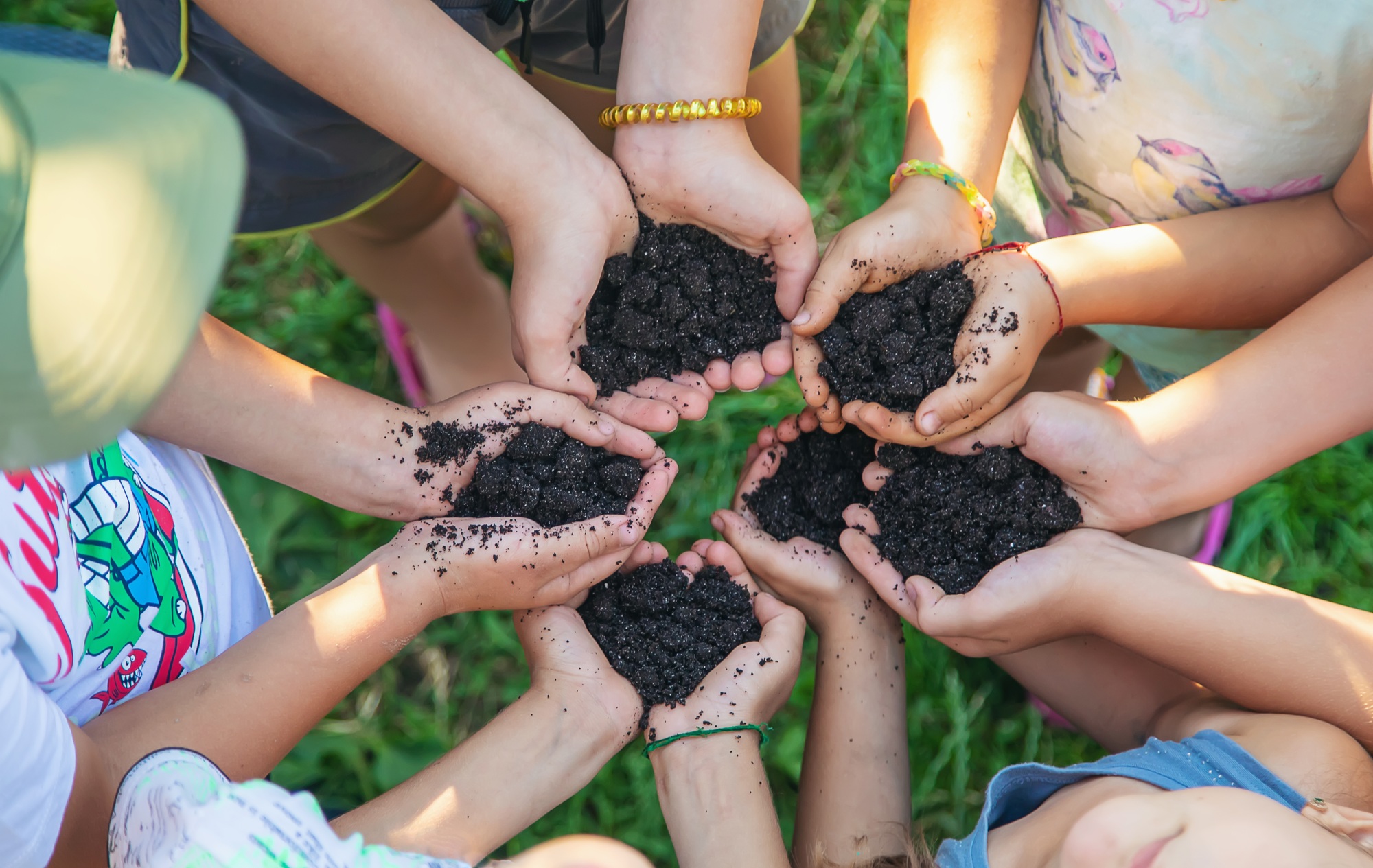 Children hold the earth in their hands. Selective focus. Children hold the earth in their hands. Selective focus.
