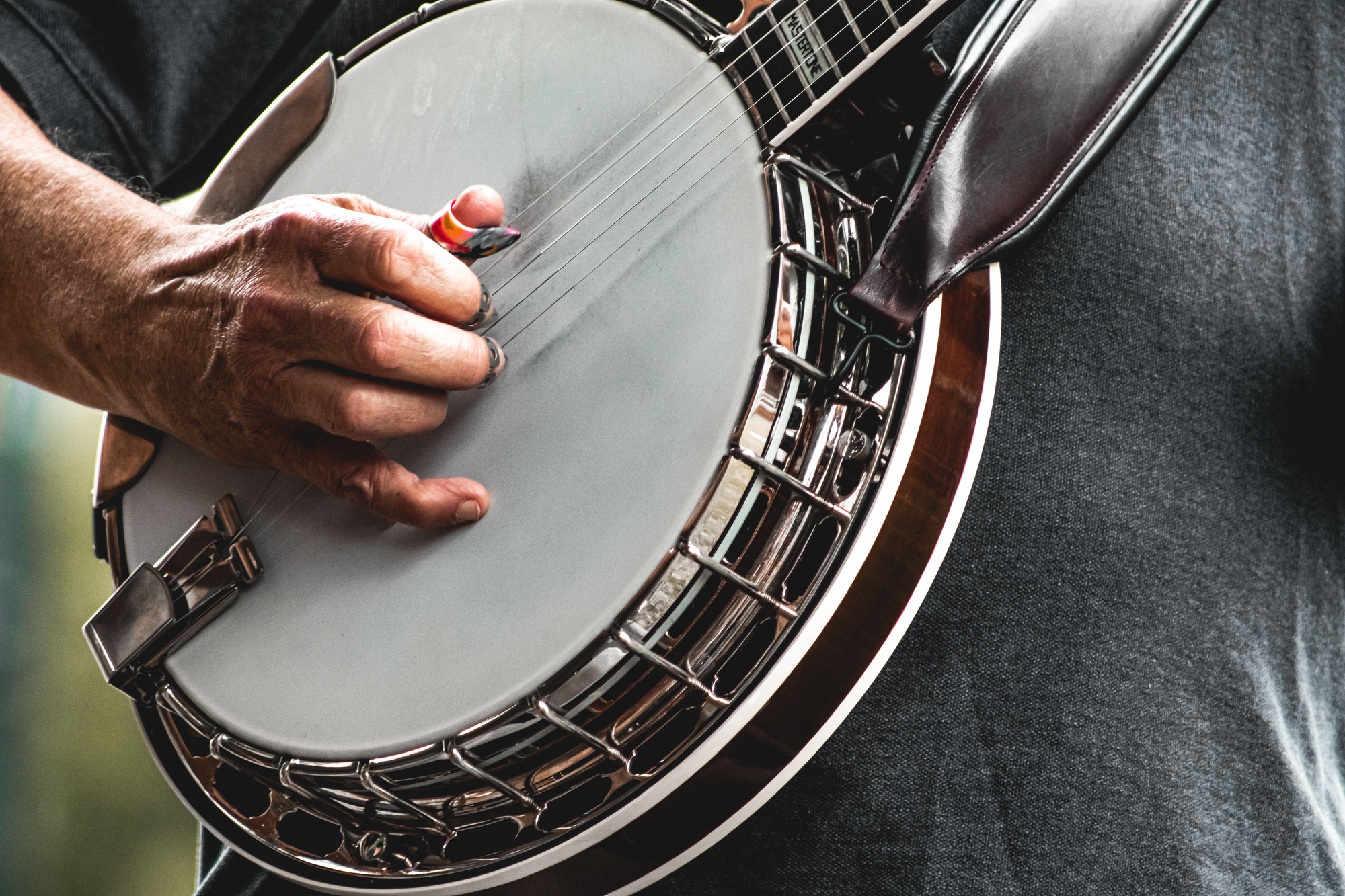 Closeup of man's hands playing banjo. Closeup of man's hands playing banjo.