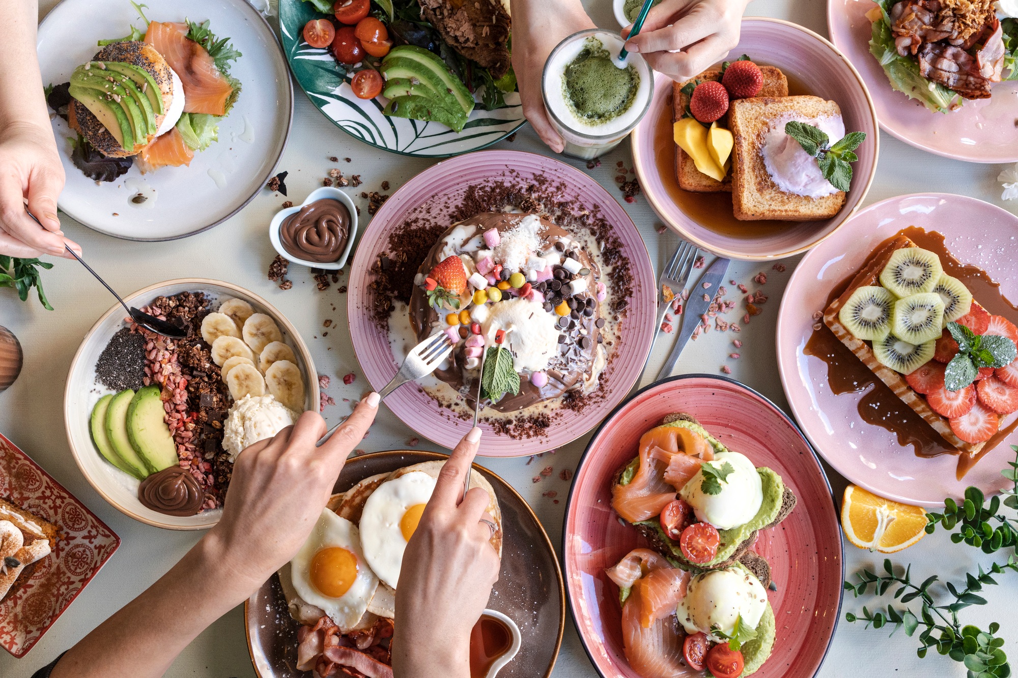 Brunch Choice Crowd Food Concept. Family breakfast or brunch served on a table. Aerial view.