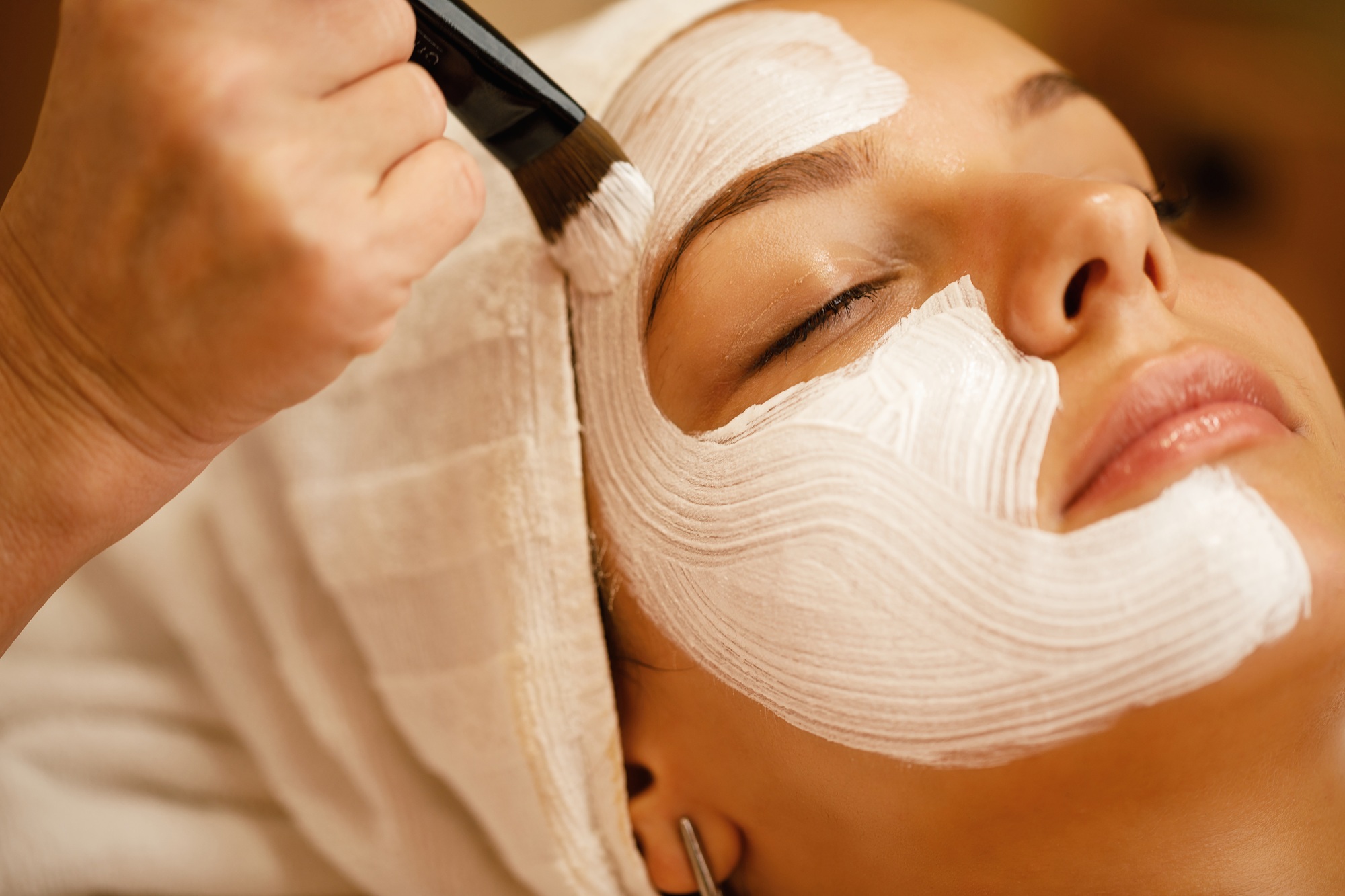 Close-up of facial treatment with detox mask. Close-up of facial treatment with detox mask.