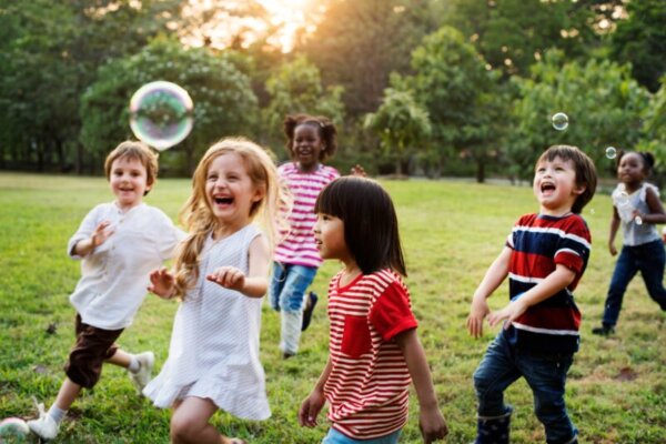 Group of Diverse Kids Playing at the Field Together