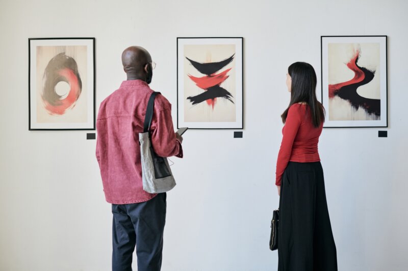 Observing Artwork in Modern Art Gallery Exhibit